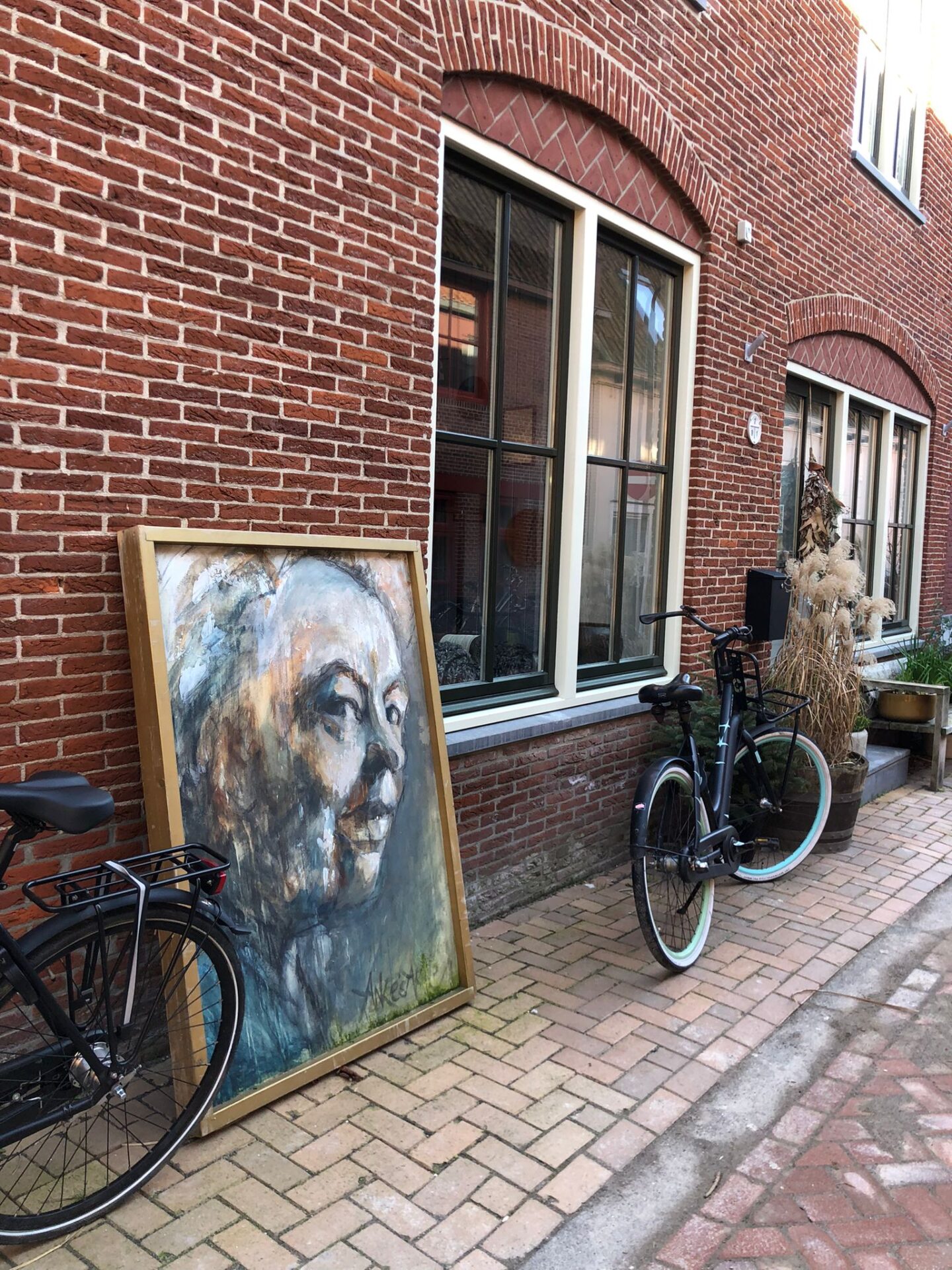dutch street in Dokkum artwork plants old building red brick photo by Kelly-Marie Williams Wierda